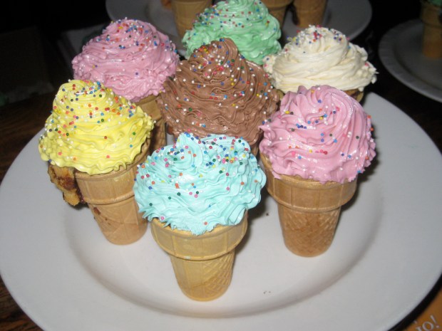 YES thats an ice cream cone filled with brownie, vanilla cake, and topped with buttercream frosting!