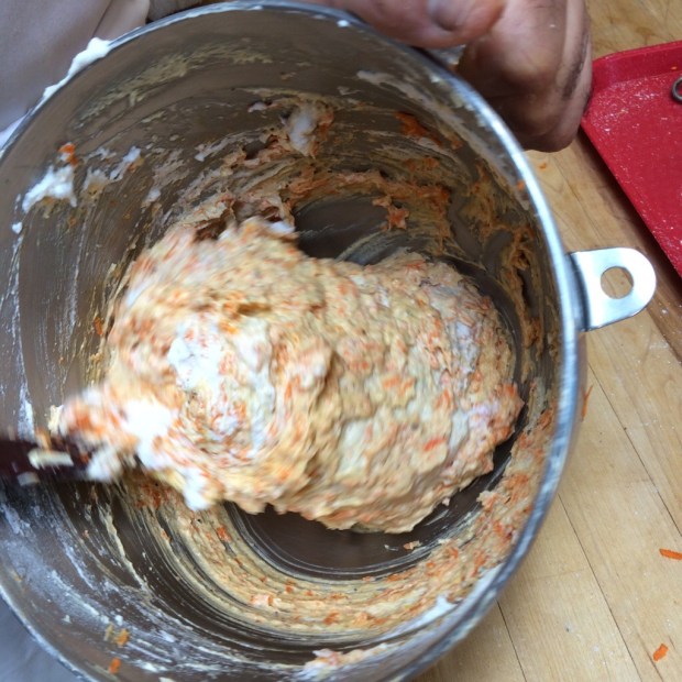 Folding the carrot cake batter.