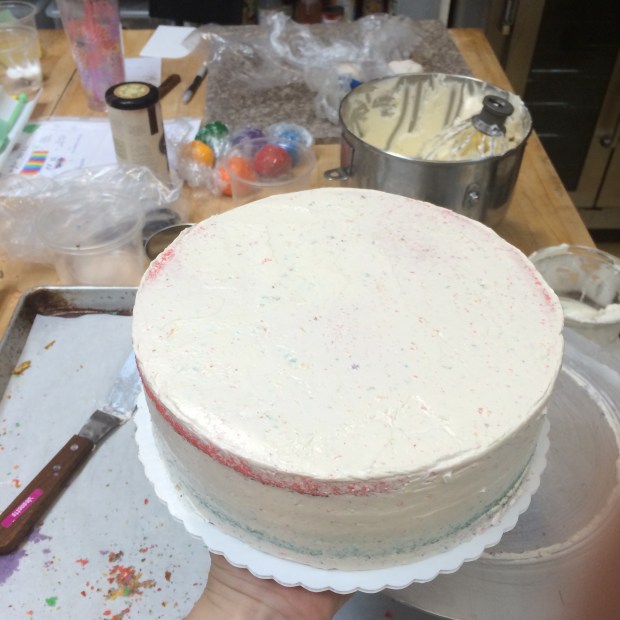 I love making the sharp edges on a cake with icing.