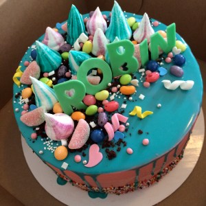 Crazy candy cake, inspired by Katherine Sabbath's work, chocolate butter cake, swiss meringue buttercream, white chocolate ganache, meringue kisses, assorted candies and fondant lettering by hand.